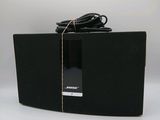 an image of a black speaker with a cord on top of it