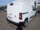 a white van that is parked in a parking lot
