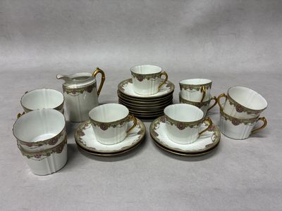 a group of cups and saucers on a table