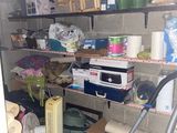 a room that has a lot of items on the shelves