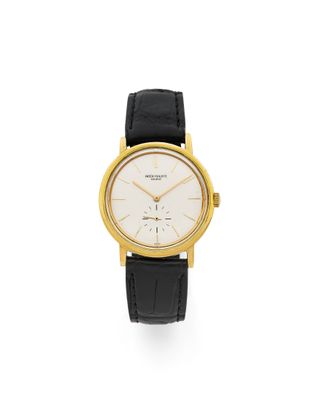 une montre-bracelet en or jaune 18 carats avec un cadran blanc