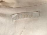 a close up of a label on a white jacket