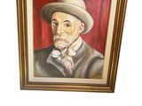tableau représentant un homme portant un chapeau et un nœud papillon, dans un cadre doré