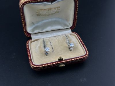 a box with three rings inside of it on a table
