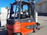 a forklift truck that is parked in a parking lot