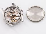 an image of a close up of a watch on a white surface