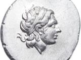 a close up of a coin with a woman ' s head on it