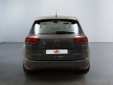 the back of a grey car with a number plate on it