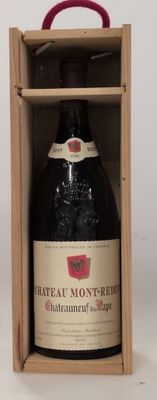 a bottle of wine in a wooden box on a table