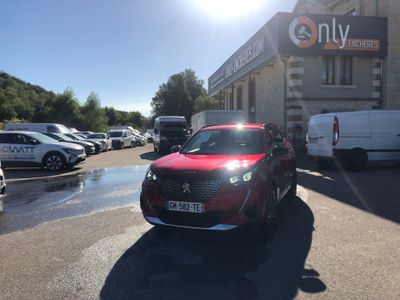 a red car that is parked in front of a building