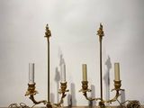 three candles that are sitting on a wooden table