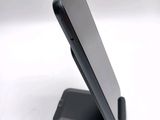 a cell phone that is sitting on top of a stand