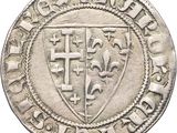 a close up of a coin with a coat of arms on it