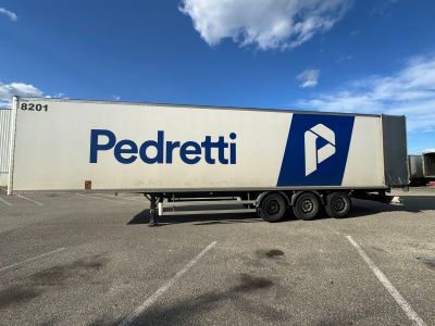 a semi truck that is parked in a parking lot