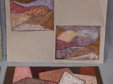two cards with a picture of a mountain range and a picture of a mountain range