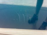 a close up of a toothbrush in a tub of water