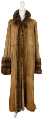 an image of a brown fur coat on a mannequin stand