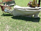 a boat that is sitting on the grass in the field