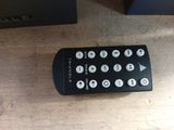 a remote control sitting on a table next to a box