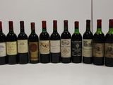 several bottles of wine are lined up in a row on a table