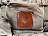 a close up of a bag with a leather patch on it