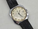 a watch that is sitting on a white surface