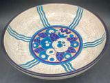 a blue and white bowl sitting on a table