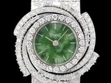 une photo d'une montre-bracelet pour femme avec un cadran vert