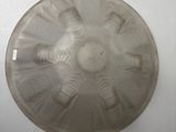 a glass plate with a design on it on a white surface