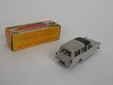 a toy car that is sitting next to a box