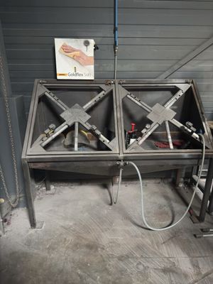 a large metal table with a lot of tools on it