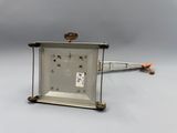 a small clock that is sitting on top of a table
