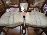 two chairs sitting next to each other on the floor
