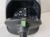 a blow dryer with a hose attached to it