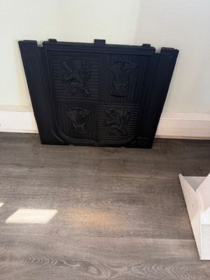 a black fire place in the corner of a room
