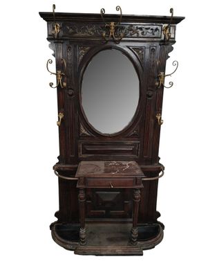 a mirror on a stand with a mirror above it