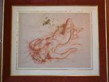 tableau représentant une femme nue allongée sur le dos, dans un cadre rouge
