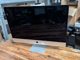a computer monitor sitting on top of a wooden desk