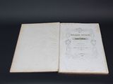 a close up of a book opened on a black surface