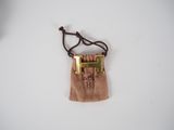 wood and brass necklace with a cross on a cord