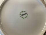 a close up of a plate with a logo on it