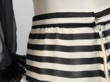a black and white striped skirt with a zipper on it
