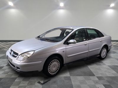 a picture of a silver car on a checkered floor