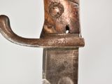 a close up of a metal object with a cat on it