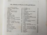 an open book with a list of items in it on a table