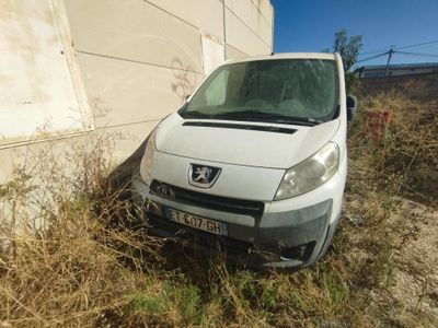 a white van that is parked next to a wall