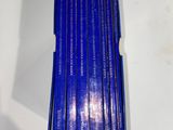 six books in a blue box on a white surface
