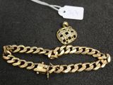 a close up of a gold chain bracelet and a gold chain bracelet