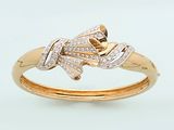 a close up of a gold ring with diamonds on it