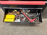 a tool box with tools in it on the ground